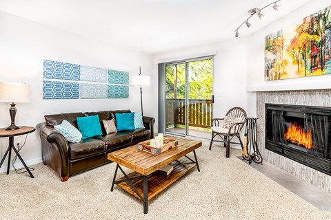 a living room with a couch and a fireplace